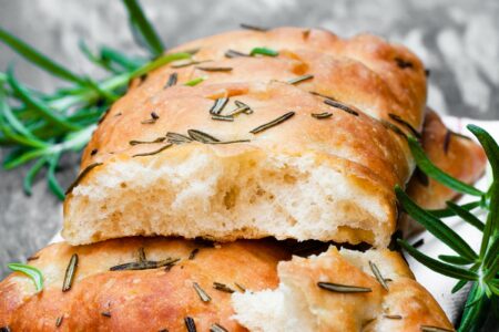 Vegan Focaccia Bread - a versatile, naturally dairy-free and cheese-free recipe. Topped with garlic and rosemary, but you can use different toppings.