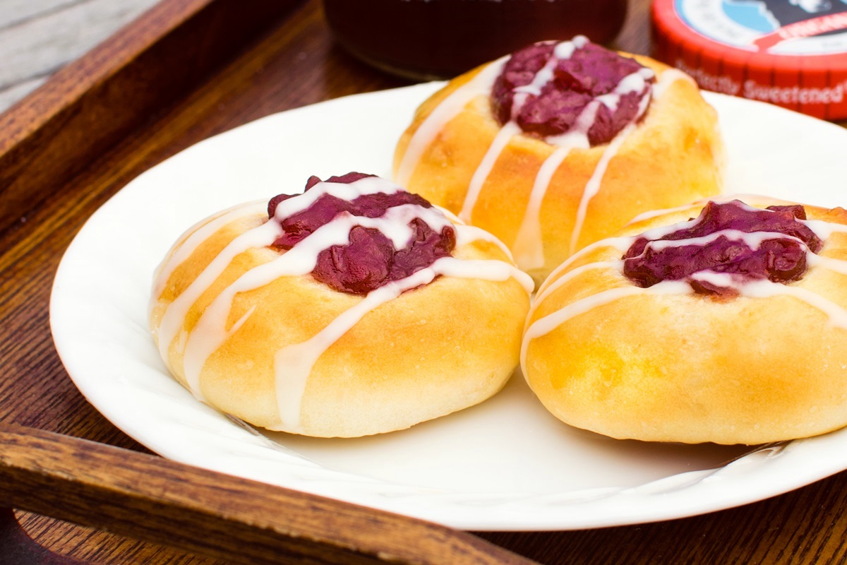 Raspberry Breakfast Buns Recipe - dairy-free, nut-free, soy-free rolls with a jam "thumbprint" and icing drizzle. Great for breakfast or afternoon tea! Can make egg-free and vegan.