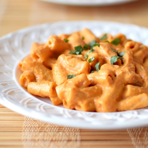100+ Rich and Creamy Dairy-Free Recipes and Foods (pictured - Creamy Roasted Tomato Vodka Sauce with Penne)