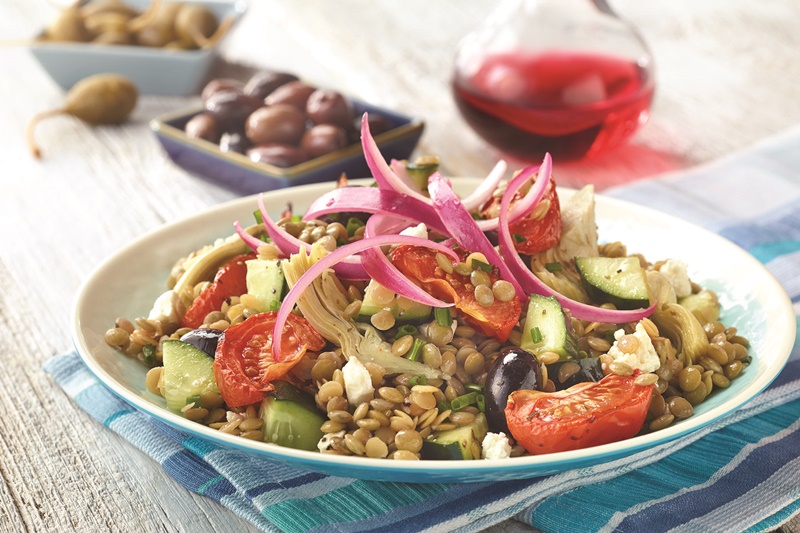 This Mediterranean Lentil Salad is fully-loaded with roasted tomatoes and Greek olives, artichoke hearts, and marinated purple onions for a light vegetarian / vegan meal or to pair with an entree from the grill.