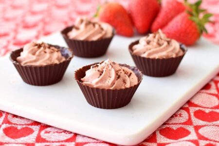 Rich, dreamy Strawberries 'n Cream Chocolate Cups - easy, homemade strawberry-infused vanilla whip piped into dark chocolate cups for a simple but dazzling dessert! (dairy-free, gluten-free, soy-free, vegan, optionally paleo)