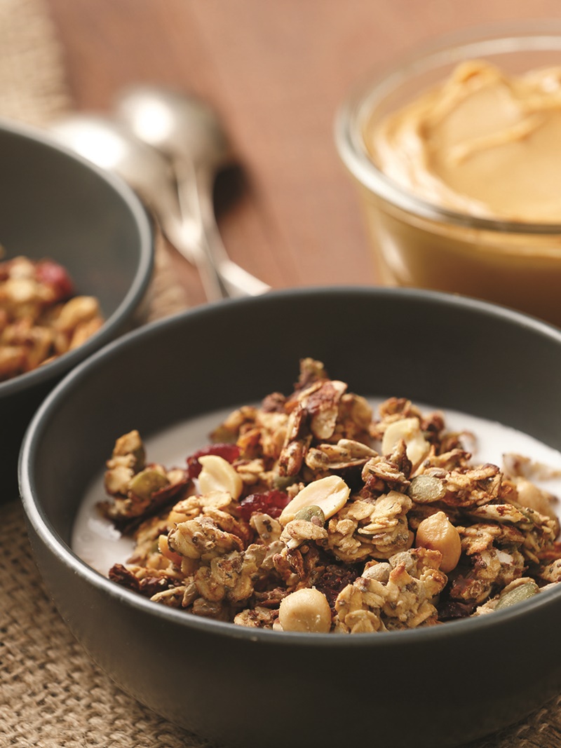 This easy, low sugar, oil-free, Nutty Homemade Granola is filled with peanutty, seedy, oaty goodness! Includes options for gluten-free, nut-free and vegan!