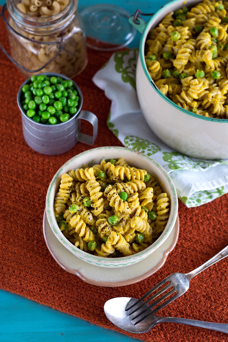 The rich sauce that completes this vegan mac 'n peas recipe is made mostly of butternut squash, but is enriched with cashews for a creamy finish, and spiked fresh garlic and flavorful, earthy spices to give it that comfort food flair. Gluten-free optional.