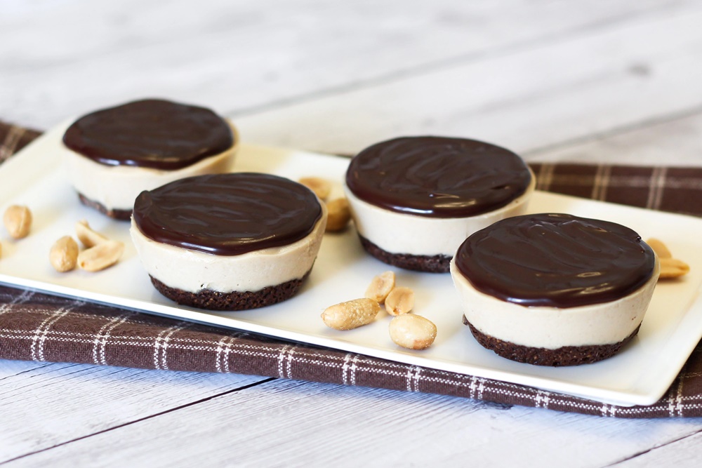 Vegan Peanut Butter Cup Pies Recipe - Chocolate gluten-free crust, rich cheesecake-like dairy-free filling, and a simple chocolate ganache! Can be made as a snack or sweeter for dessert!