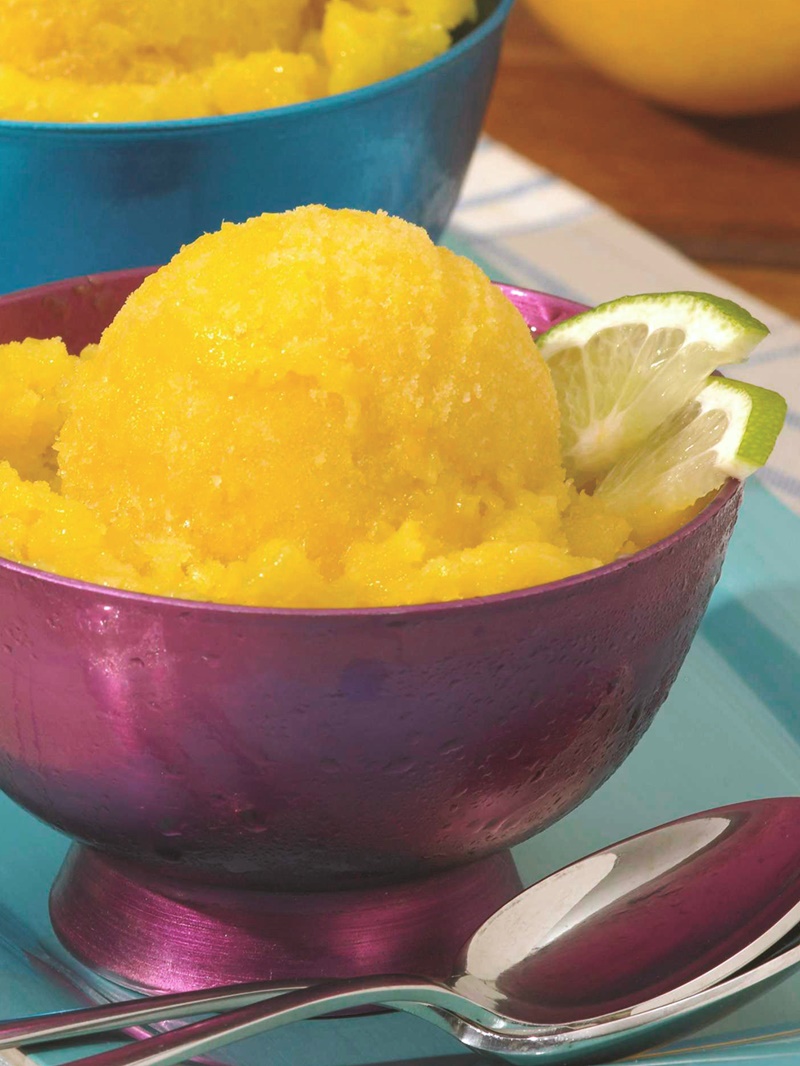 Tropical Mango Sorbet Recipe - Naturally sweet with fresh mango, pineapple, lime and a hint of coconut. Vegan, optionally paleo.