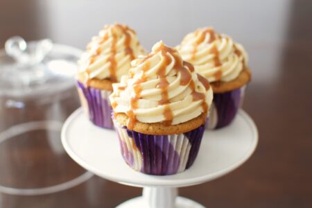 Vegan Butterscotch Cupcakes - over the top! Three recipes in one: eggless brown sugar cupcakes, vanilla dairy-free buttercream, and a quick butterscotch sauce.