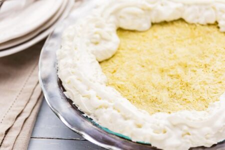 Easy Vegan Coconut Cream Pie Recipe made simple with Jell-O Pudding! Dairy-free, egg-free, nut-free, soy-free, and optionally gluten-free