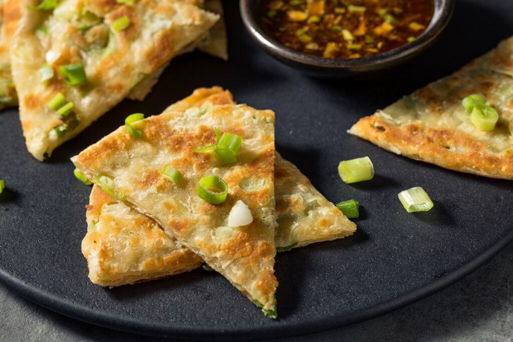 Chinese Scallion Pancakes Recipe also known as Green Onion Pancakes or Savory Pan-Fried Flatbread Loaded with Green Onions- naturally vegan, egg-free, nut-free, and soy-free