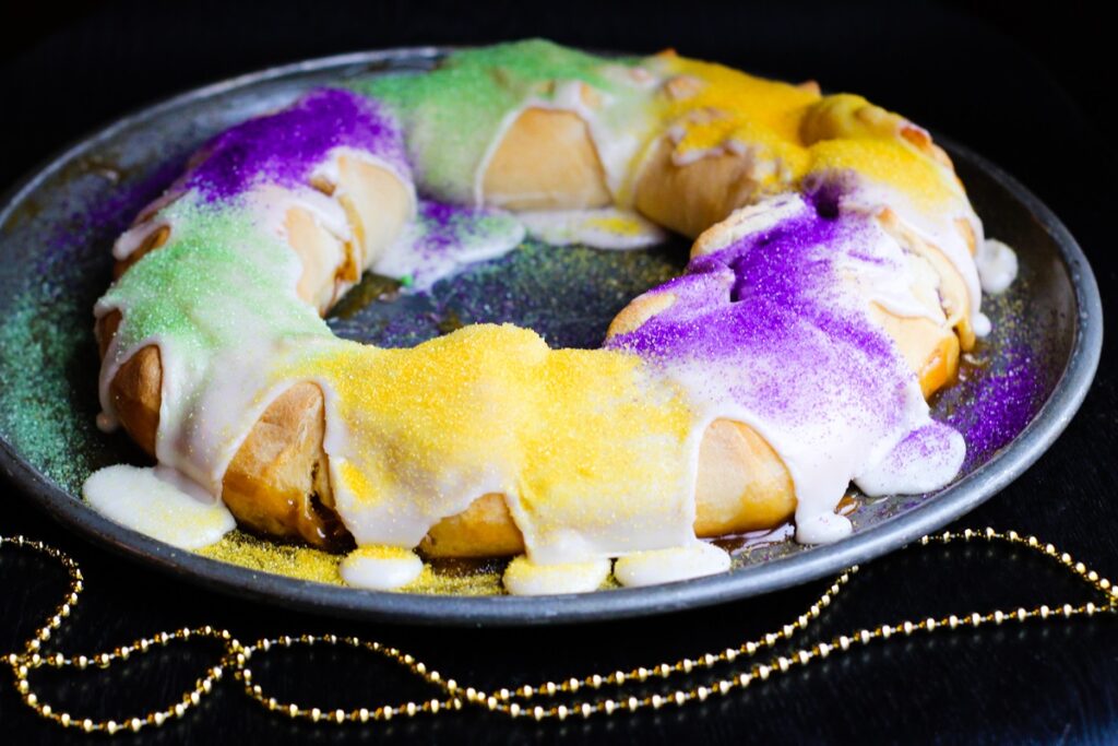 Dairy-Free King Cake Recipe - A super-easy, kids can bake, Mardi Gras dessert that's made with refrigerator biscuits! Great for an anytime dessert, too!