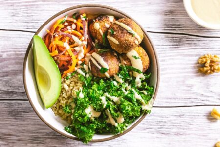 Sweet Potato Falafel Bowls Recipe with Quinoa, Kale, and Tahini Dressing - plant-based and dairy-free with vegan option.