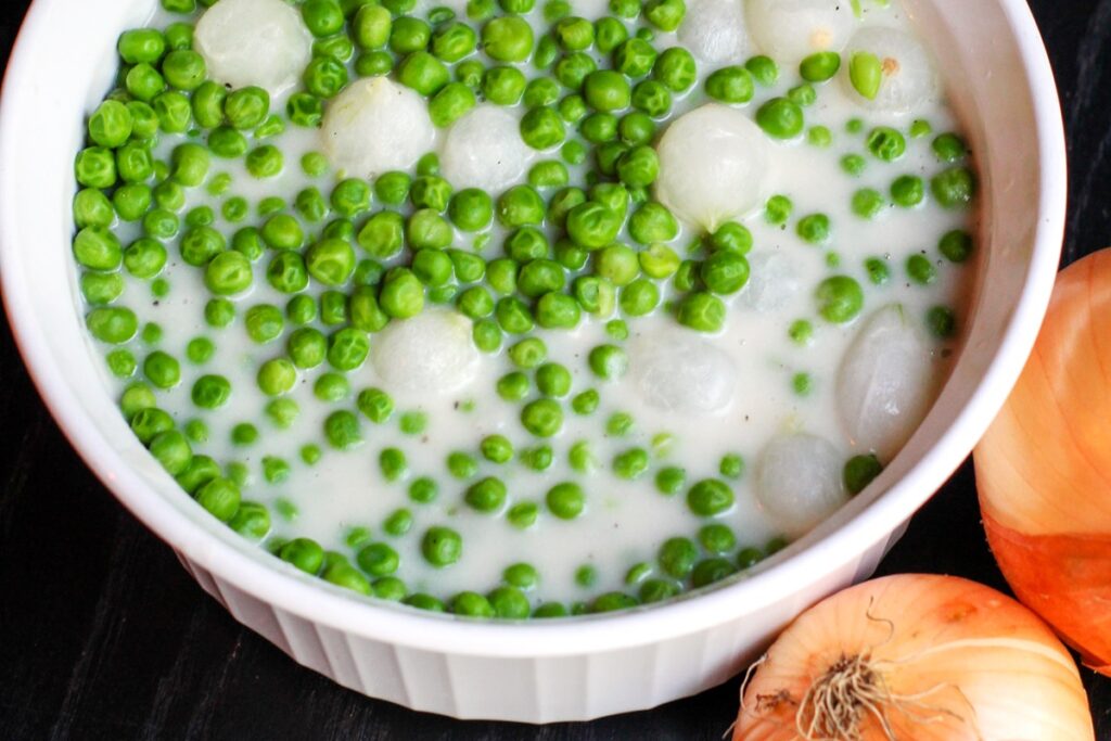 Dairy-Free Creamed Peas and Pearl Onions Recipe - also vegan, nut-free, soy-free, and optionally gluten-free. Great for weeknight meals and holiday feasts!