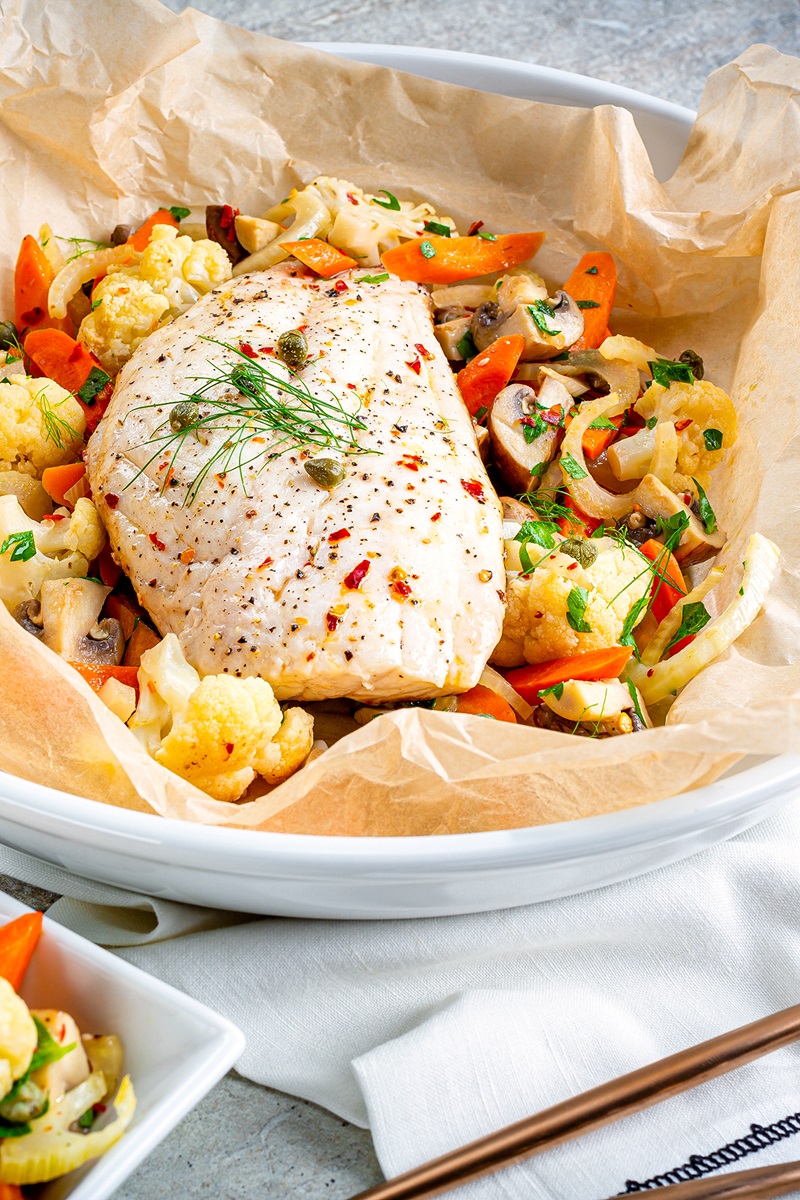 Parisienne Snapper with Vegetables is Deliciously Simple Fish En Papillote (in Parchment!). Healthy and Naturally dairy-free, gluten-free, grain-free, egg-free, nut-free, and paleo-friendly. Works great with chicken too!