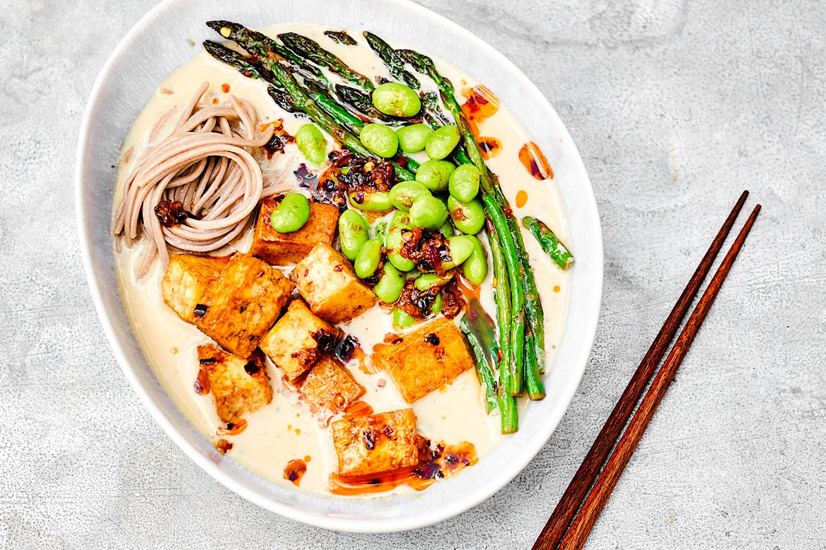 Creamy Vegan Miso Ramen Recipe with Shiitakes, Tofu, and Asparagus - a dairy-free dish by Meera Sodha. Modeled after a Japanese restaurant favorite. Gluten-free option.