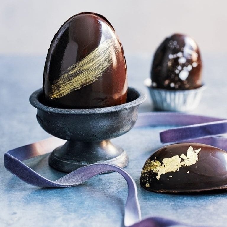 Dairy-Free and Vegan Alternatives to Cadbury Creme Eggs, including chocolate eggs with various cream fillings. US, Canada, UK, Europe, and Australian options! Pictured: Gnosis Raw Golden Eggs