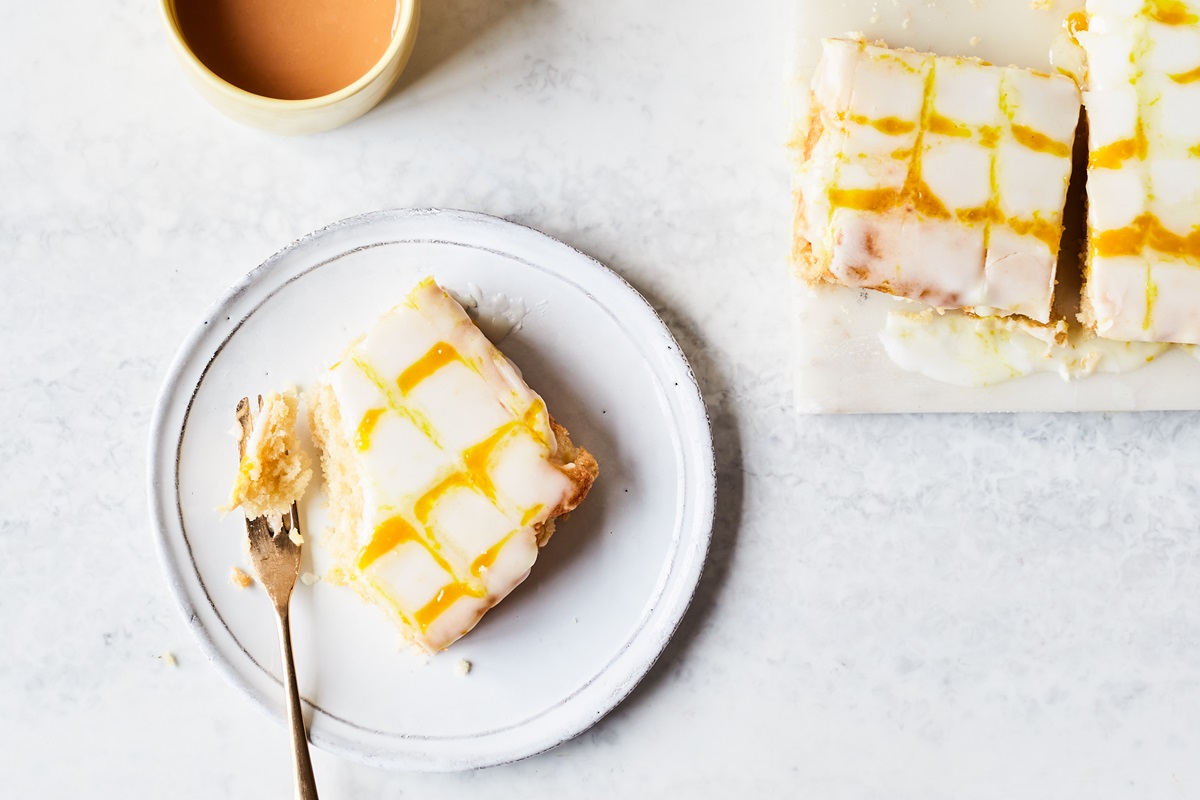 Vegan Lemon Cake with Lemon Curd Drizzle Recipe - a popular British Tray Cake made without Eggs or Dairy! Also nut-free and optionally soy-free.