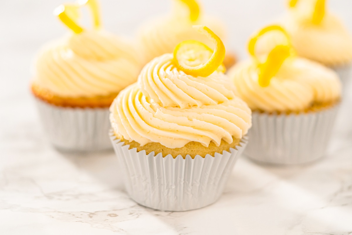 Dairy-Free Lemon Cupcakes Recipe - made with oil, not butter, but includes various options. Easy, fast, cheap, one-bowl recipe! No mixer needed - just a bowl and a whisk!