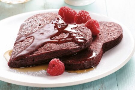 Dairy-Free Red Velvet Pancakes Recipe with various topping options, including Dairy-Free Cream Cheese Topping